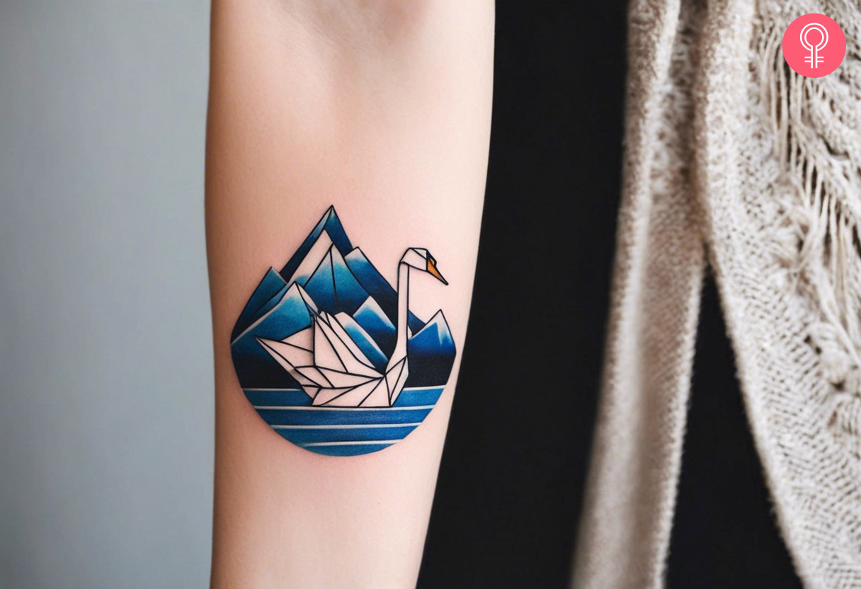 Woman with an origami swan tattoo on the forearm