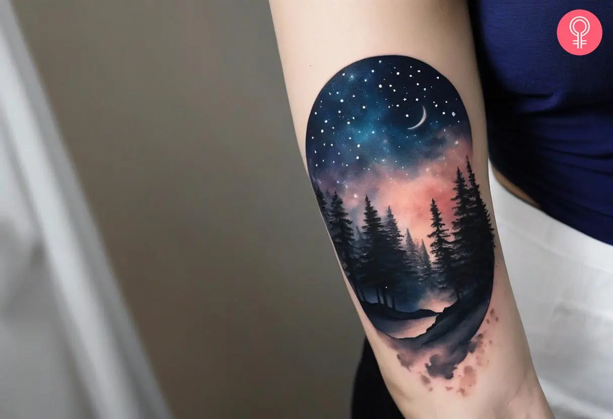 Woman with astronomy celestial tattoo on her upper arm