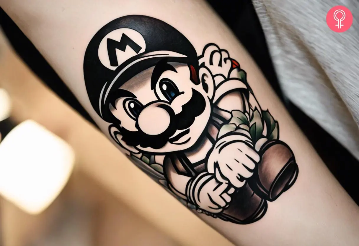 Woman with black and white super mario tattoo on her forearm