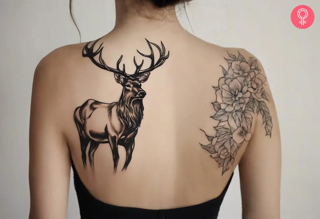 Woman with bull elk tattoo on her upper back