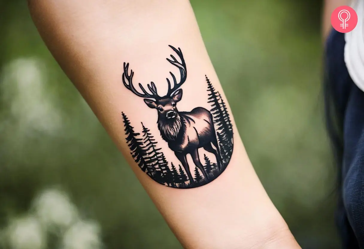 Woman with forest elk tattoo on her forearm