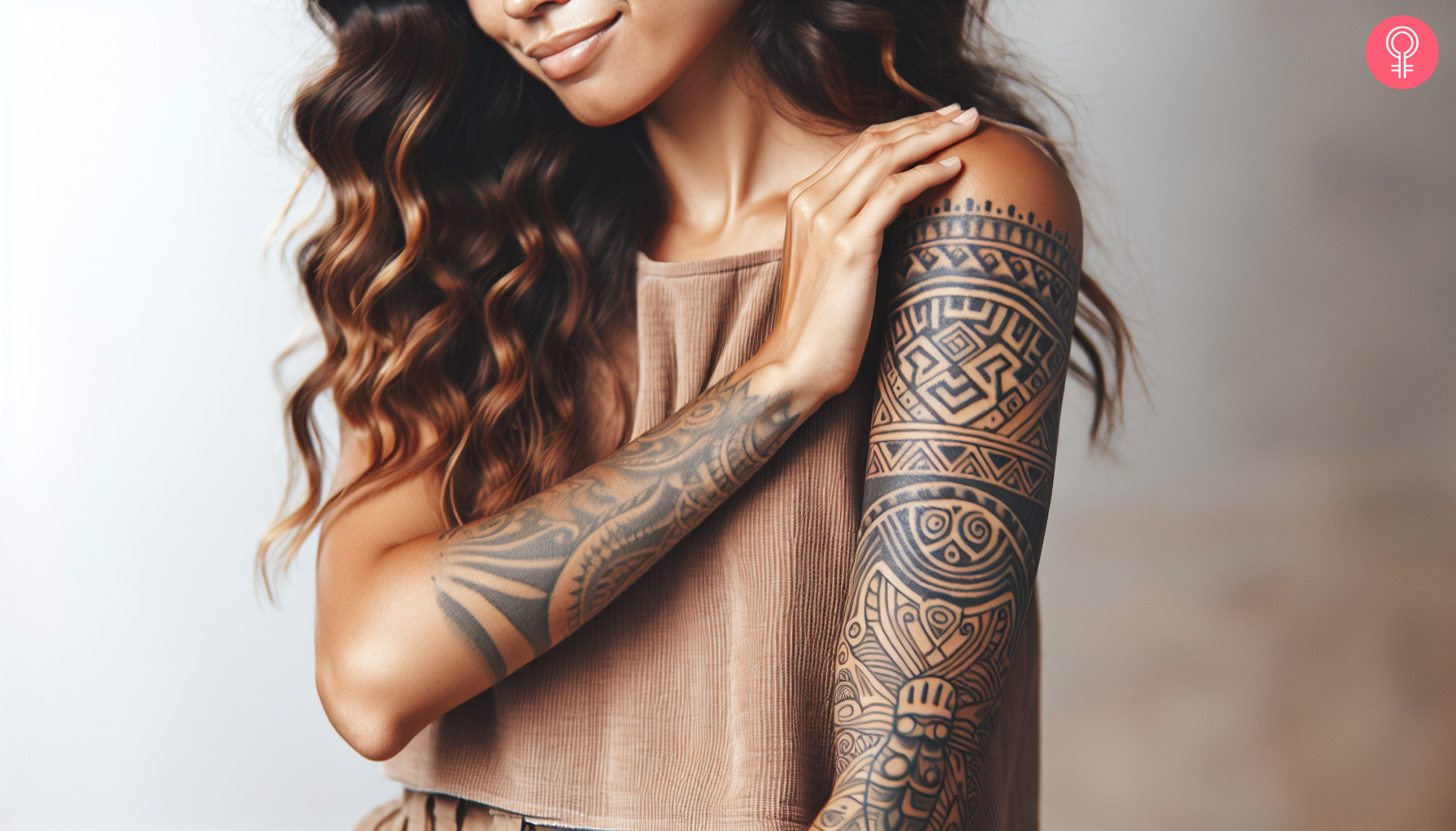 Woman with marquesan symbol tattoo on her arm