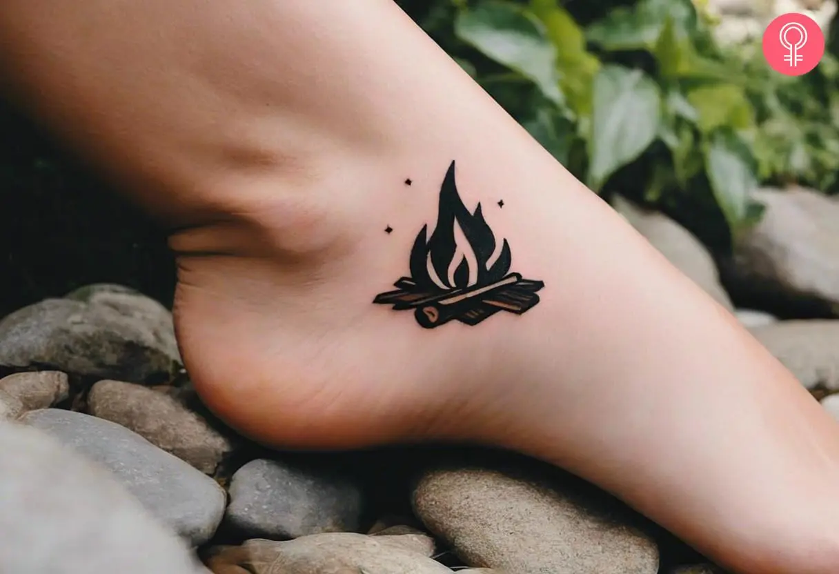 Woman with minimalist campfire tattoo on her ankle