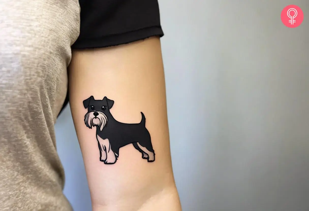 Woman with minimalist schnauzer tattoo on her arm