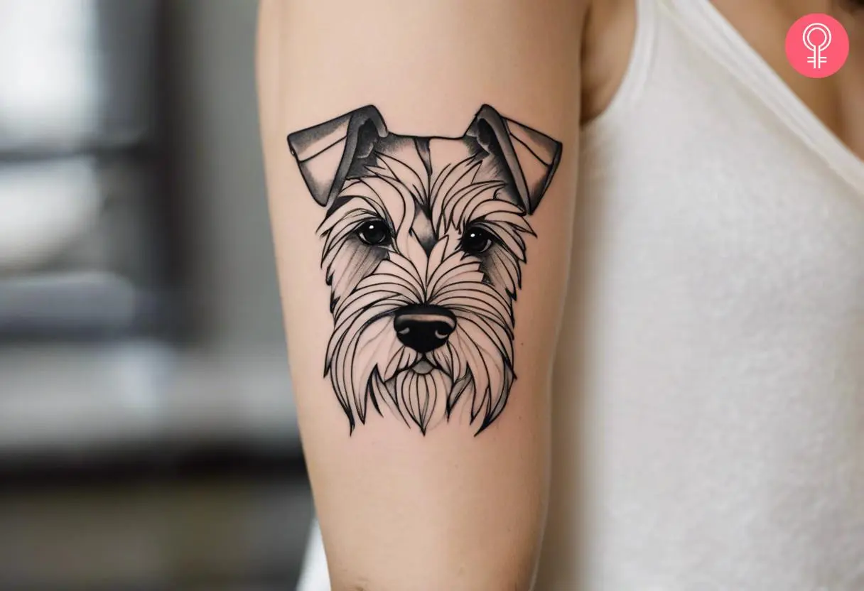 Woman with schnauzer line tattoo on her arm