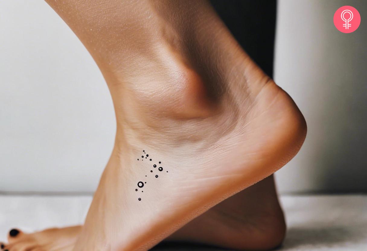 Woman with small bubbles tattoo on her ankle