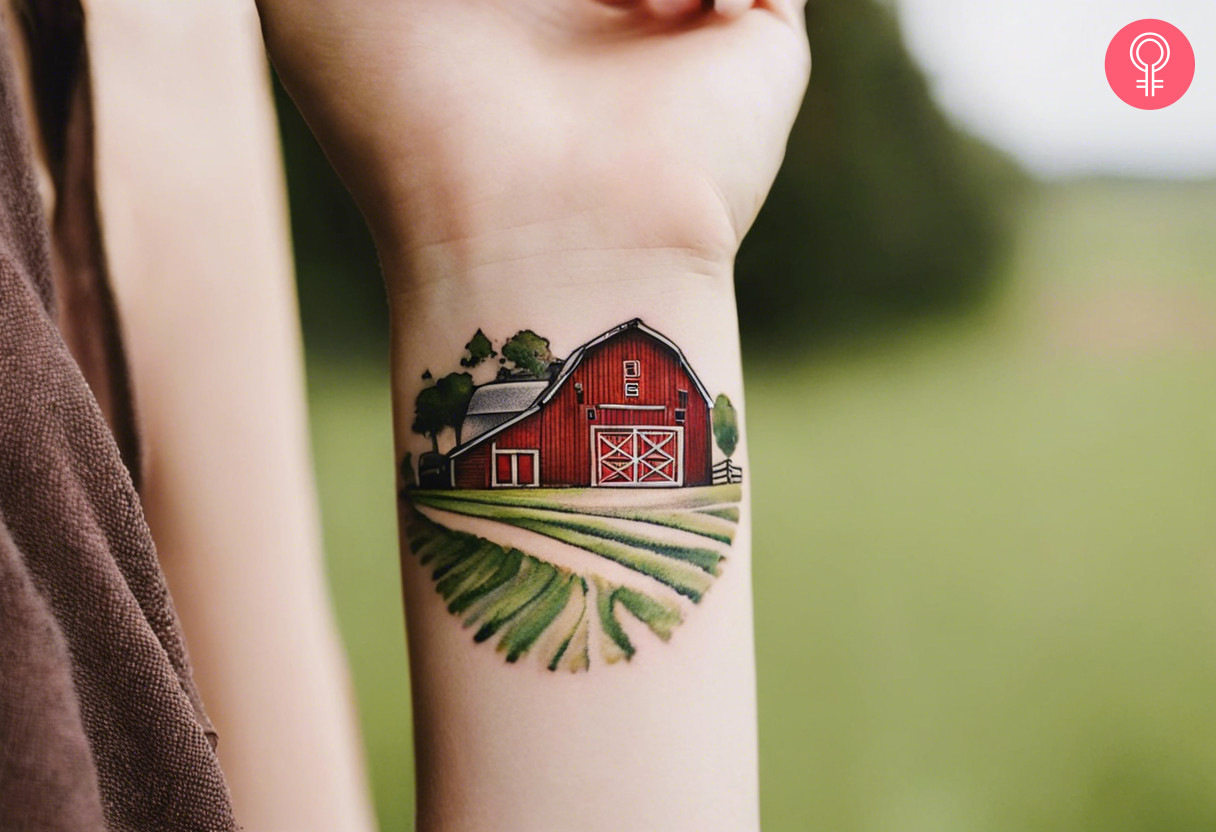 Woman with small farm tattoo on her wrist