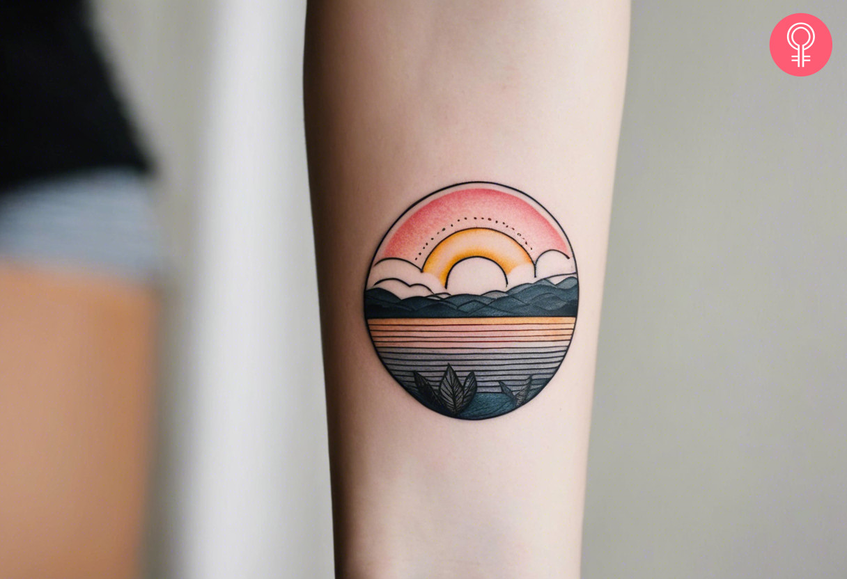 Woman with sunrise tattoo on her forearm