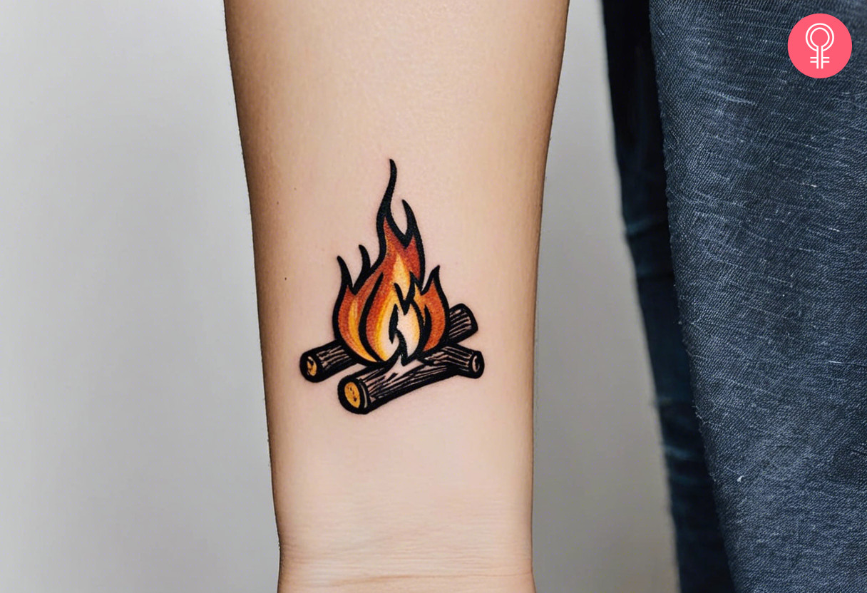 Woman with tiny campfire tattoo on her wrist