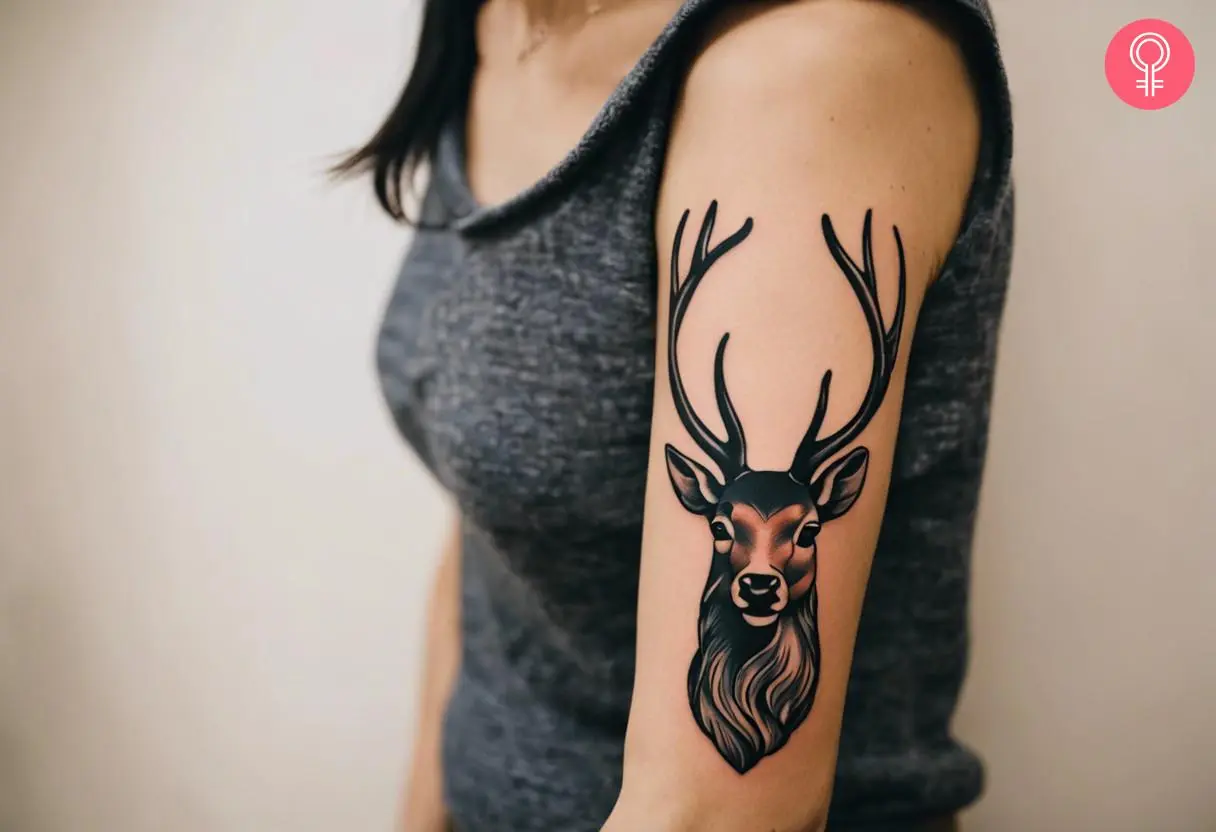 Woman with traditional elk tattoo on her arm