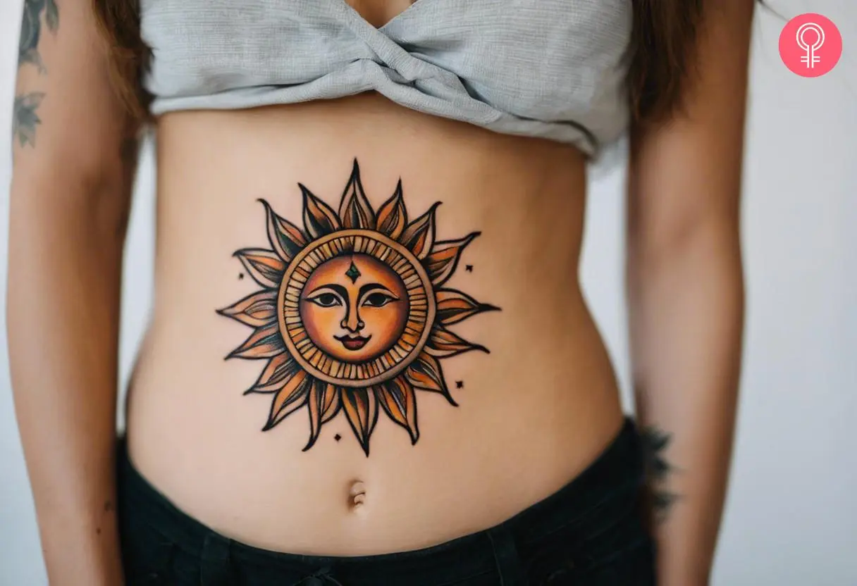 Woman with traditional sun tattoo on her stomach