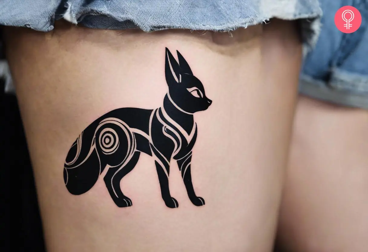 Woman with tribal Umbreon tattoo on her thigh