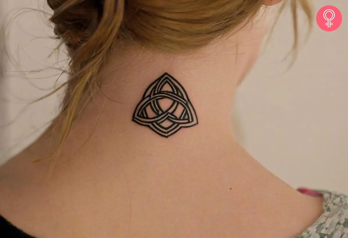 Woman with warrior celtic knot tattoo on the back of her neck