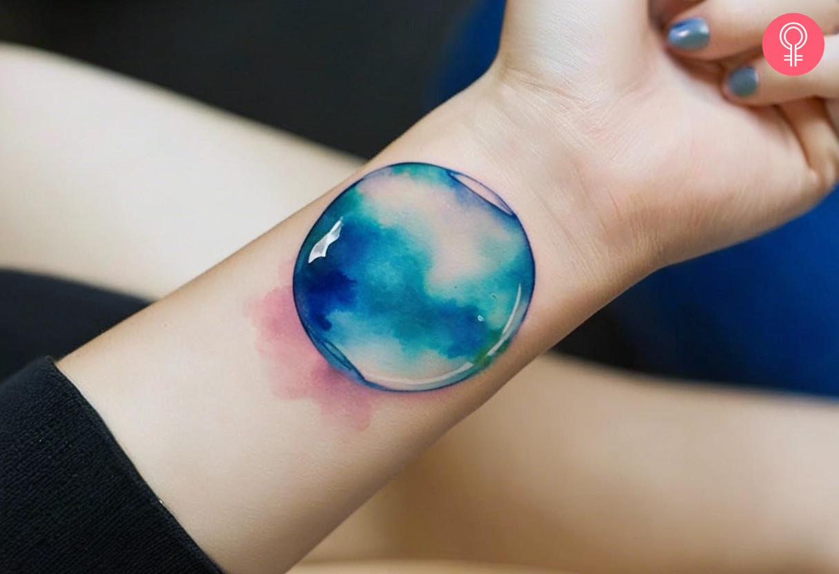 Woman with water bubble tattoo on her wrist