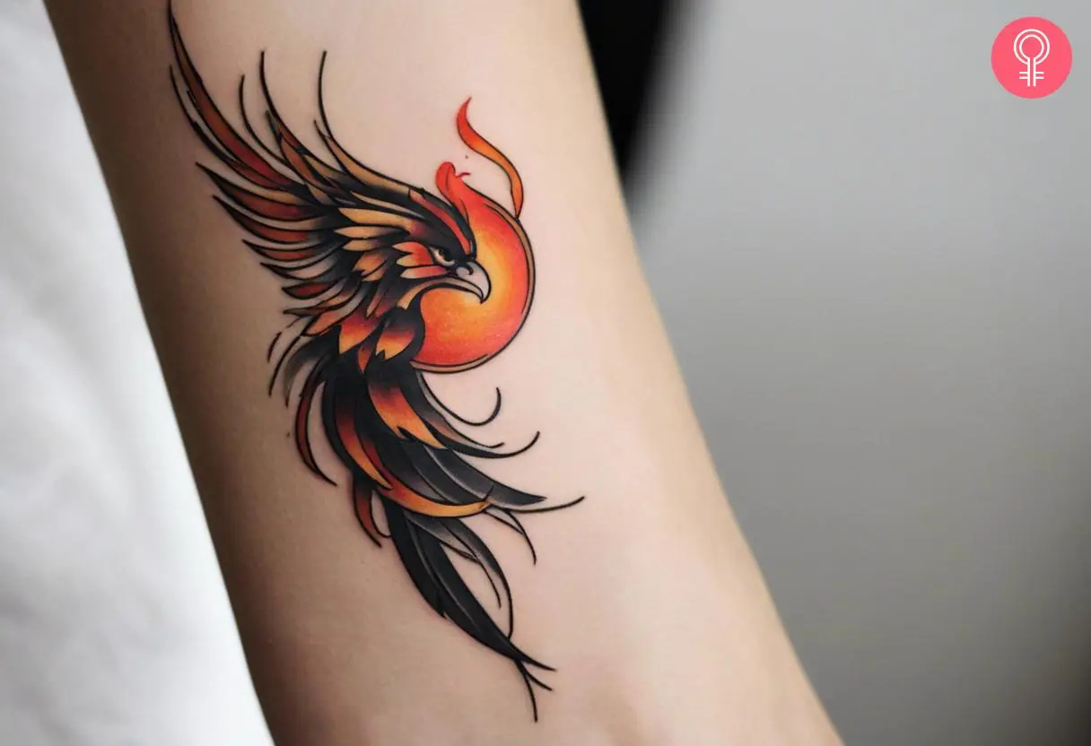 Woman with yakuza style phoenix tattoo on her wrist