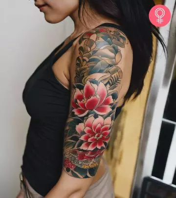 A woman with an elaborate SF 49ers tattoo on her upper arm