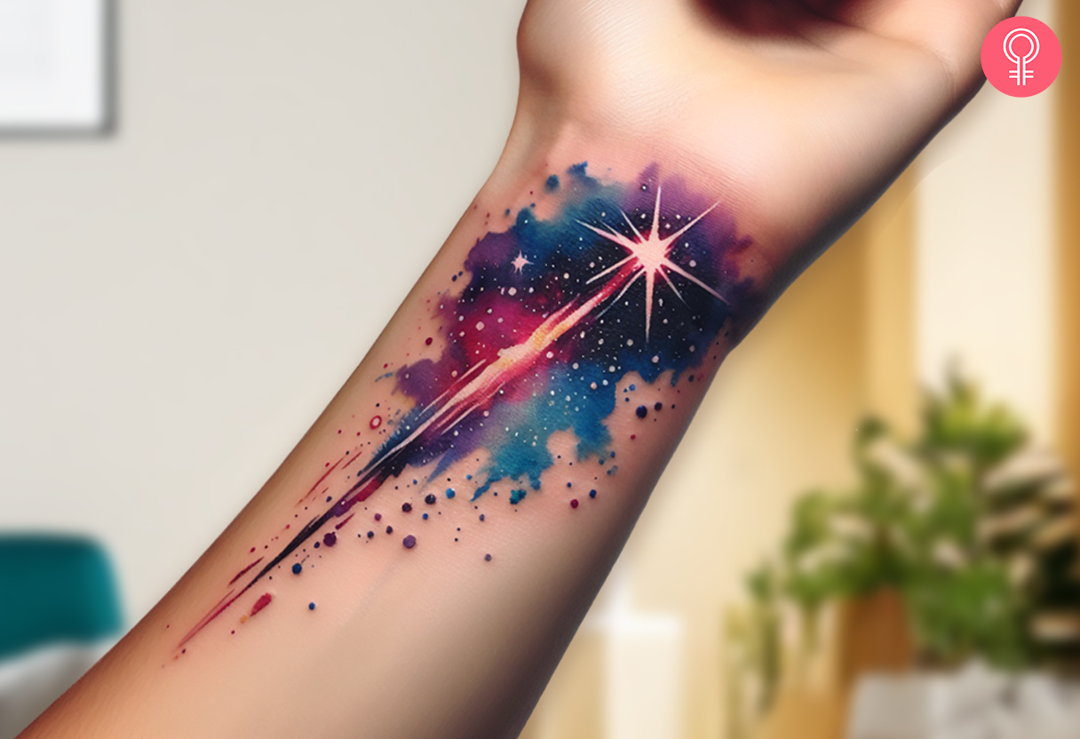 Woman with a water-colored shooting star tattoo on her wrist