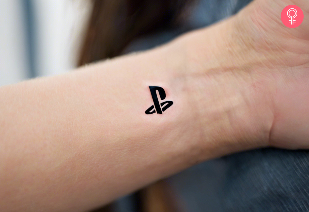 A PlayStation tattoo on a man’s wrist