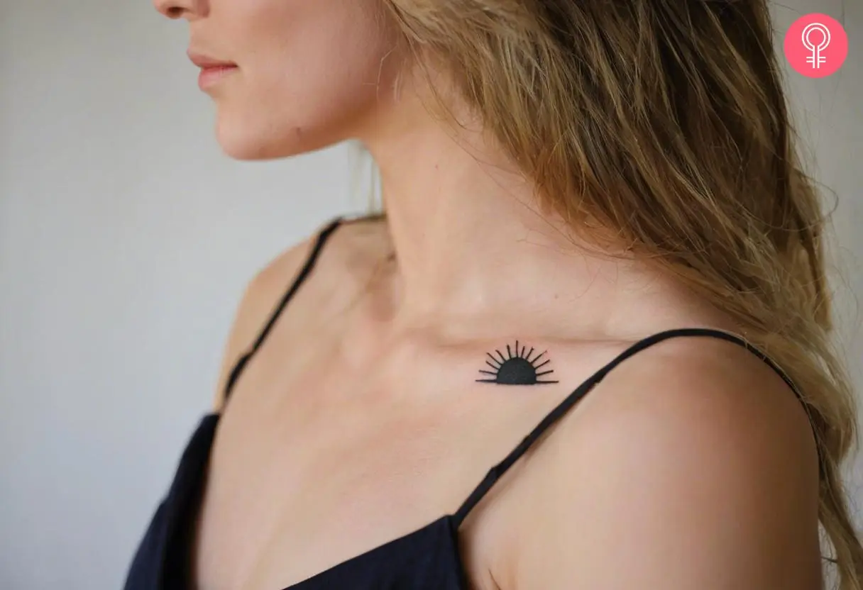 woman with Half Sun Outline Tattoo on her collarbone