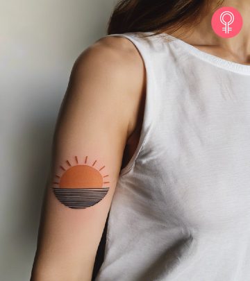 A woman with a pattern tattoo on the upper arm