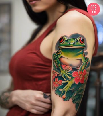 A woman with a colored Shih Tzu tattoo on her upper arm