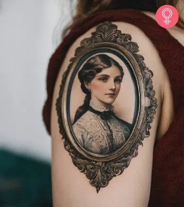 A woman with a Victorian frame tattoo on her arm