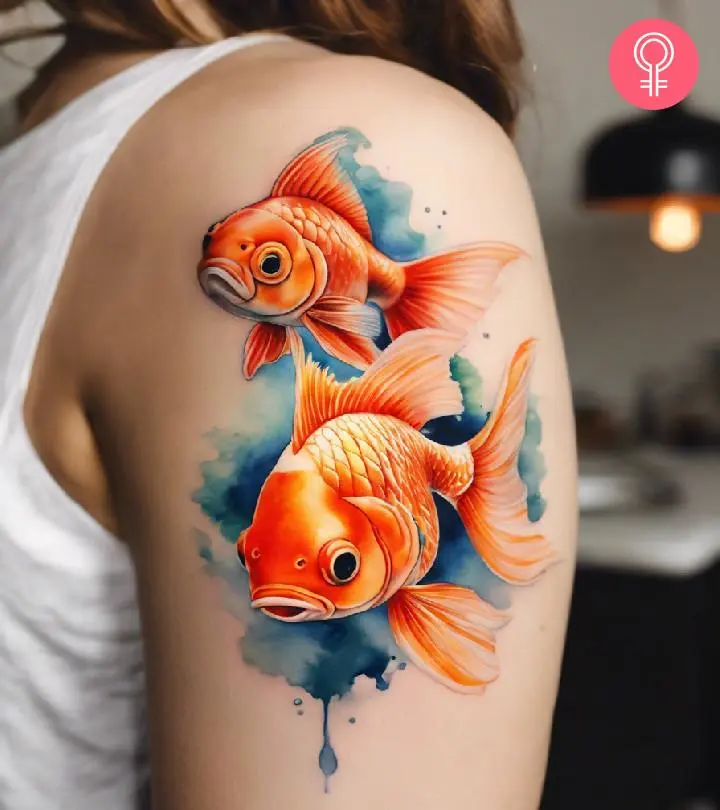 A goldfish tattoo on a woman’s shoulder