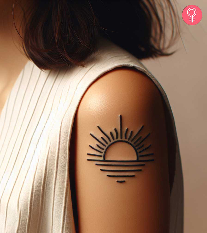 A woman with a minimalistic rising sun tattoo on the upper arm