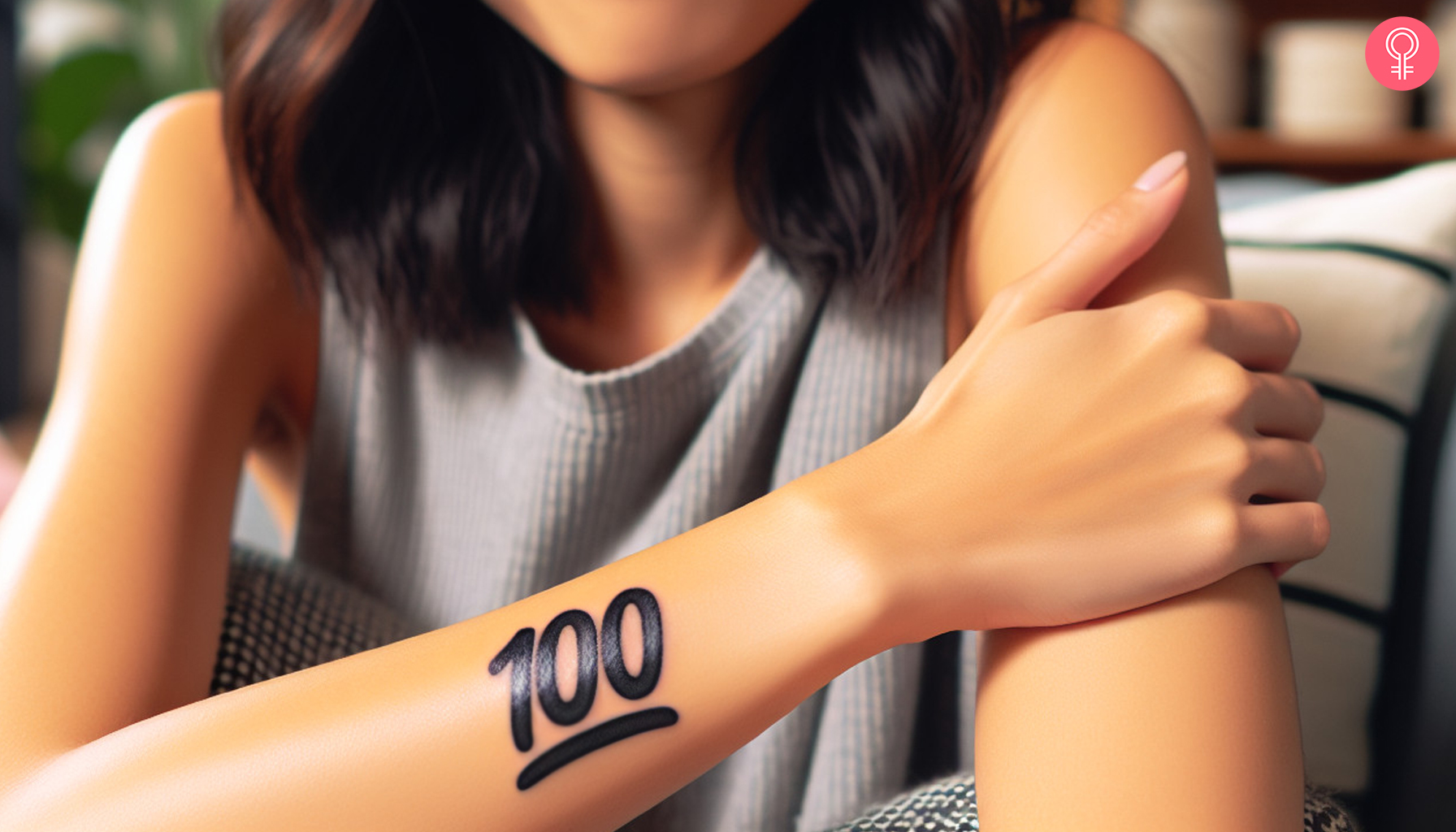 A 100 emoji tattoo on a woman’s arm