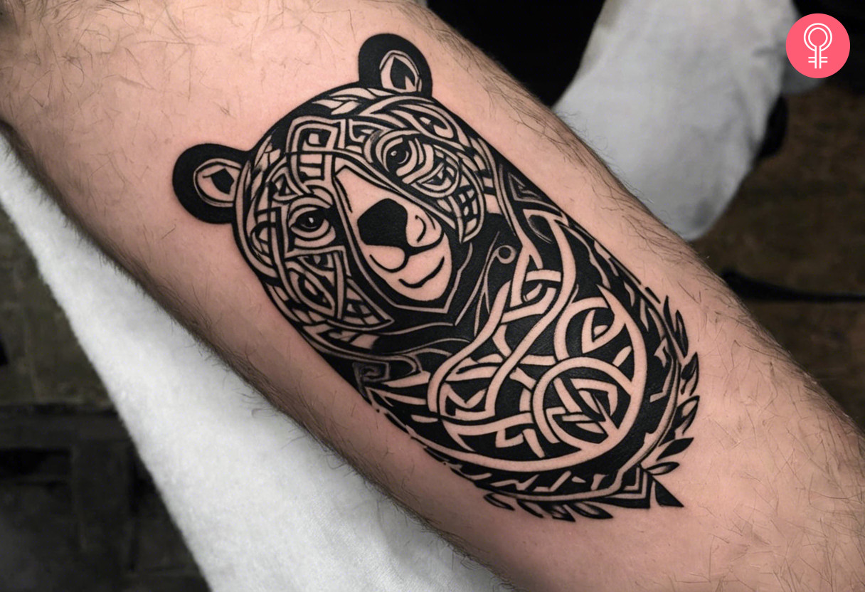 A Celtic bear bust tattoo on the forearm