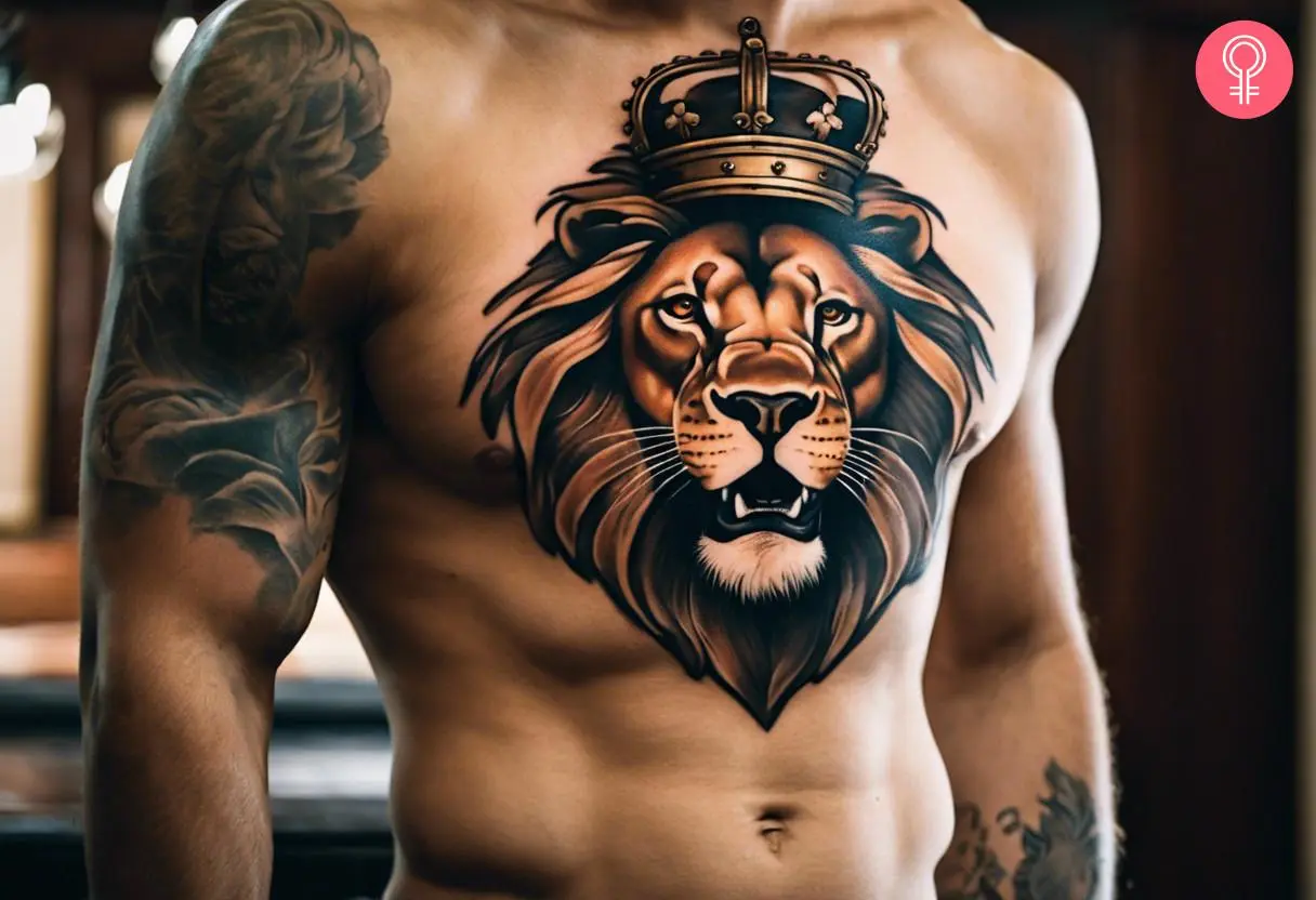 A Lion with a crown chest tattoo with its mouth open in a roar