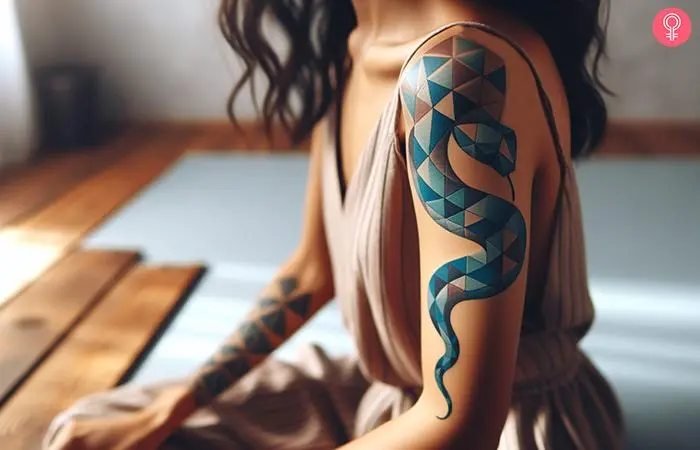 A beautiful geometric sea serpent tattoo in shades of blue