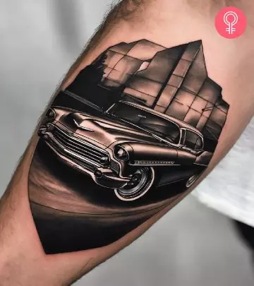 A black-and-white Chevvy car tattoo on the forearm