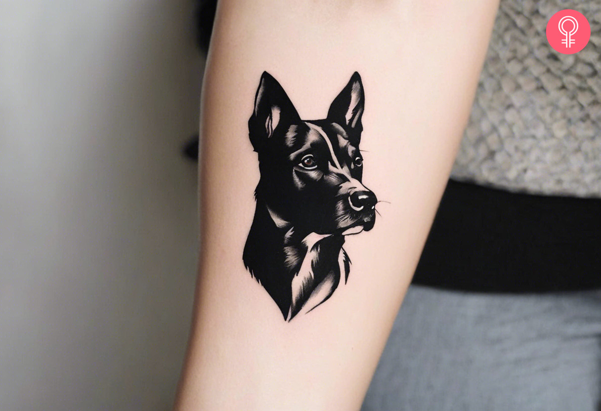 A black dog portrait tattoo