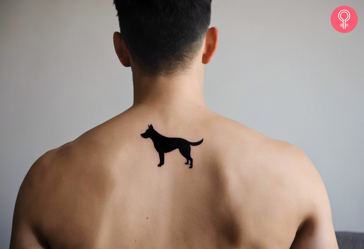 A black dog tattoo on the back