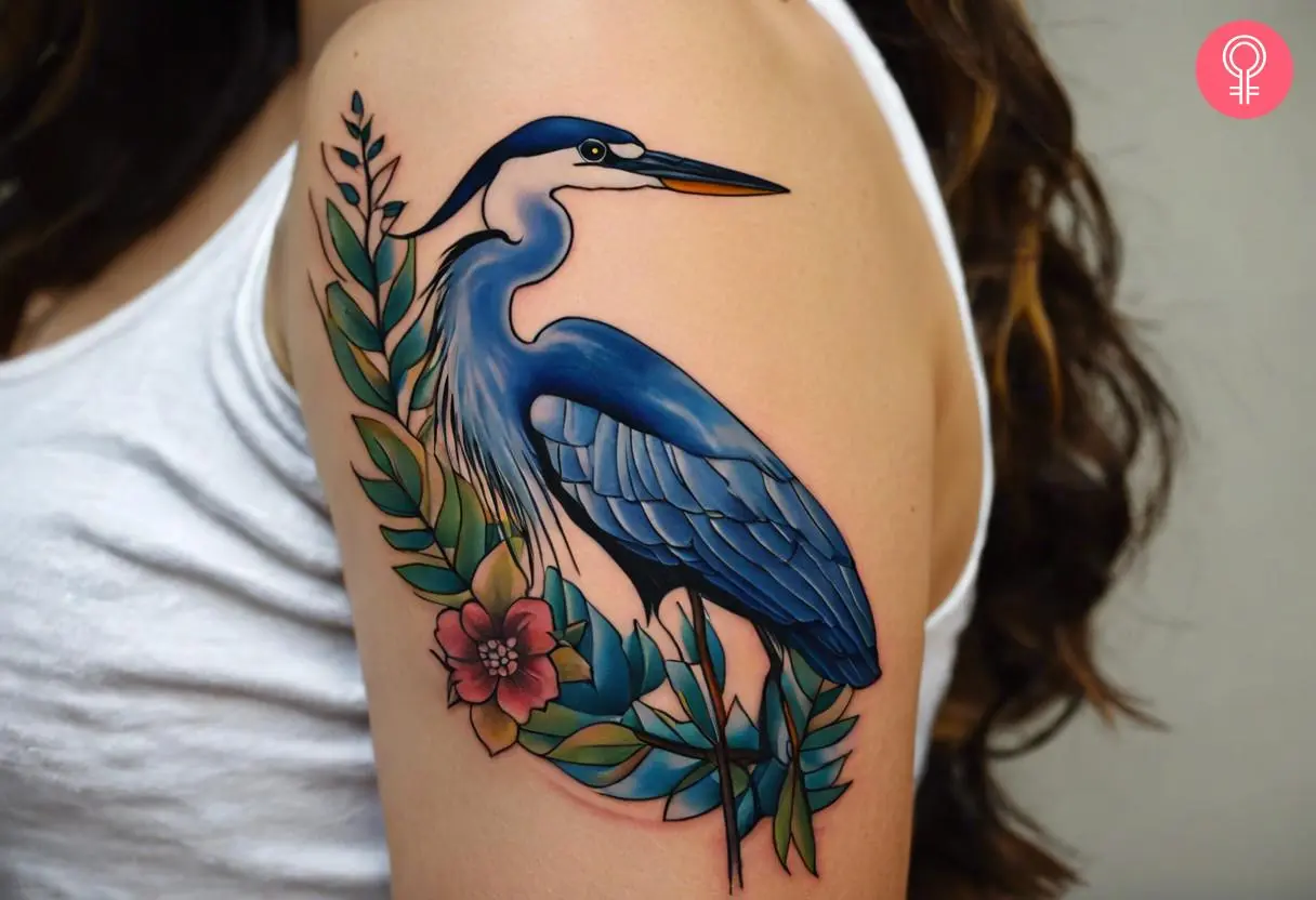 A blue heron tattoo on a woman’s bicep