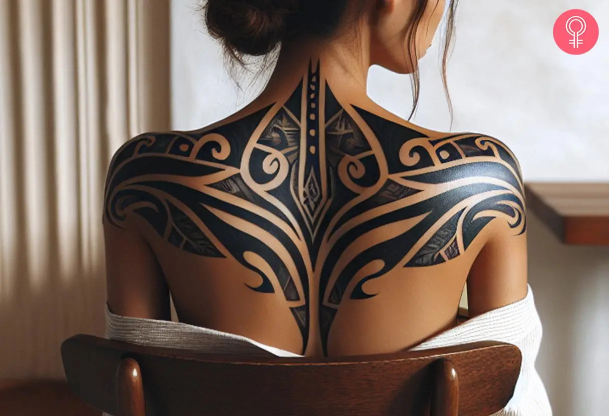 A bold black geometric design with swirls covering the upper back