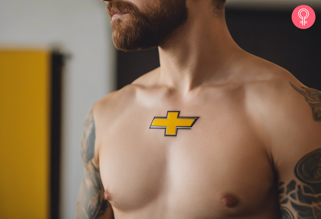 A bright yellow chevvy bowtie tattoo on the upper middle chest