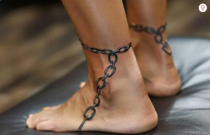 A chain tattoo around the ankle