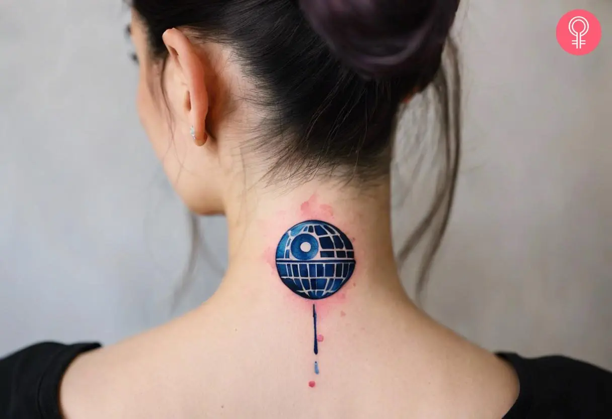 A death star tattoo on the back of the neck of a woman