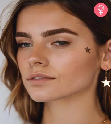 A dotted-style star tattoo on the cheekbone