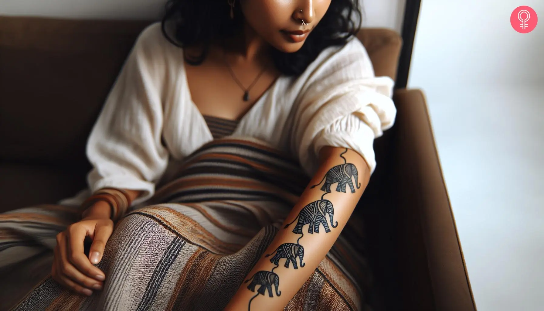 A family concept tattoo on a woman’s arm