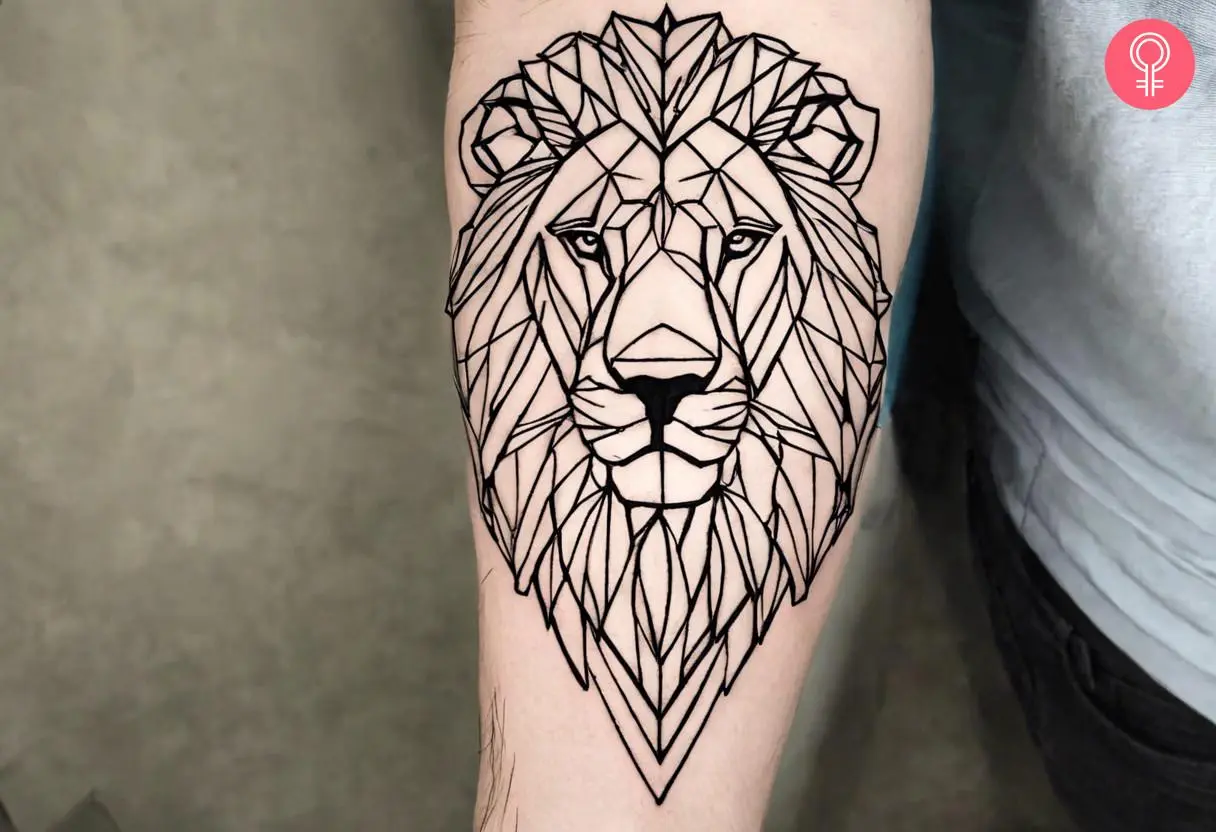 A geometric lion stencil sketch tattoo on the forearm