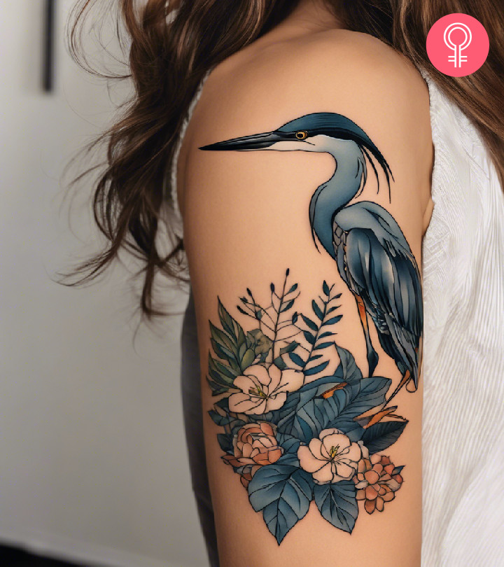 A heron tattoo on a woman’s bicep