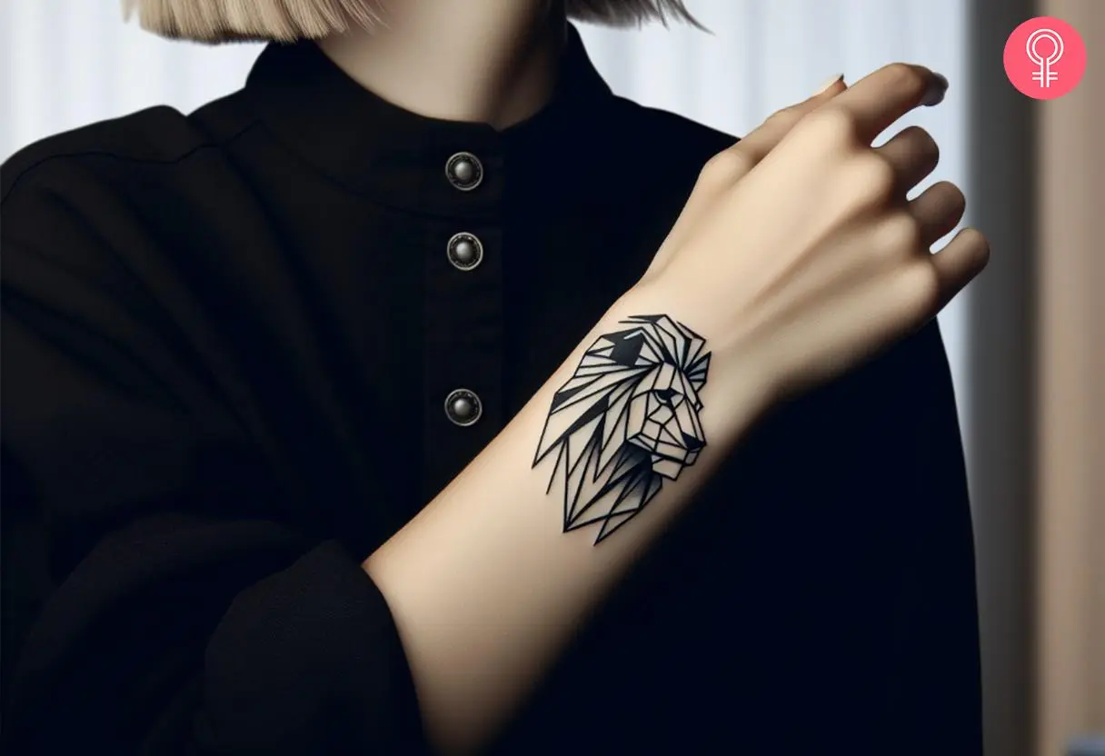 A line art geometric lion tattoo on the wrist