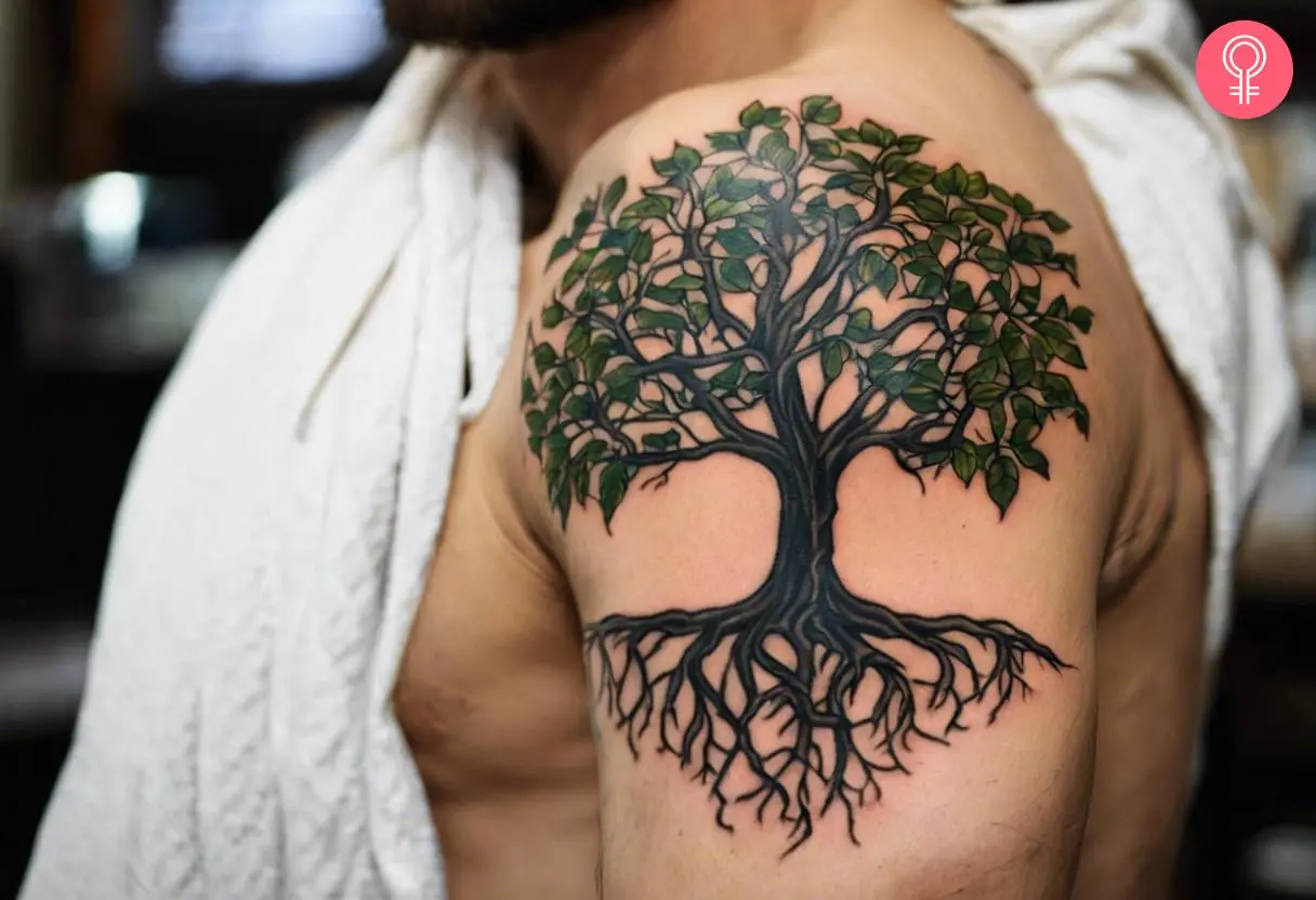 A man flaunting tree roots tattooed on his shoulder