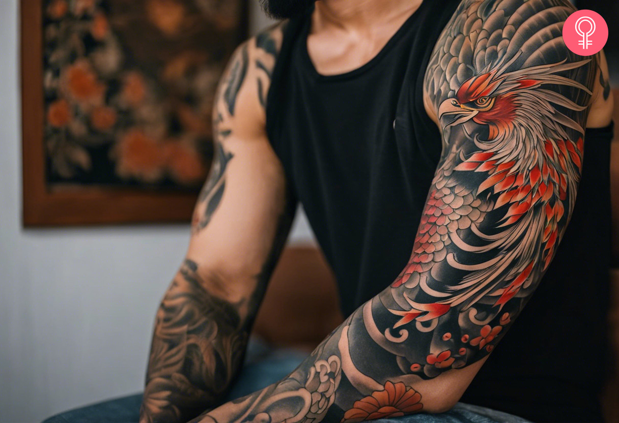 A man wearing a Japanese phoenix arm tattoo.