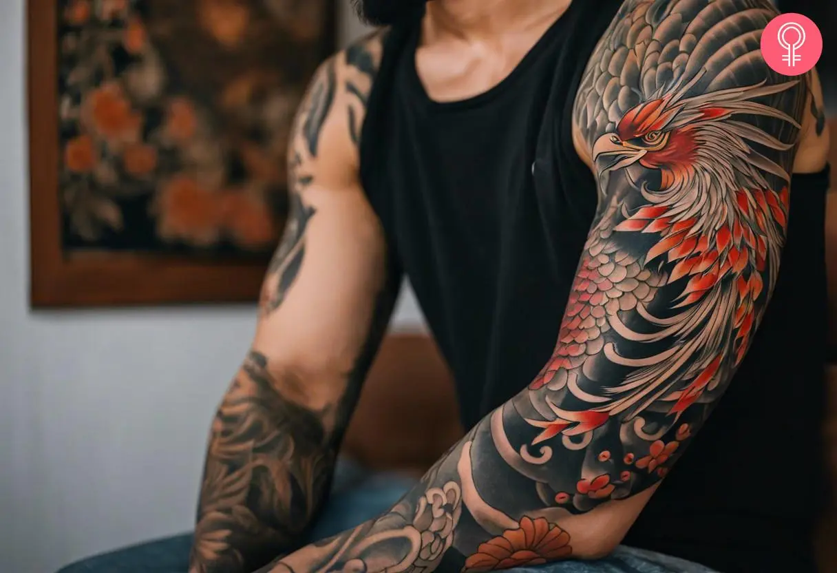 A man wearing a Japanese phoenix arm tattoo.