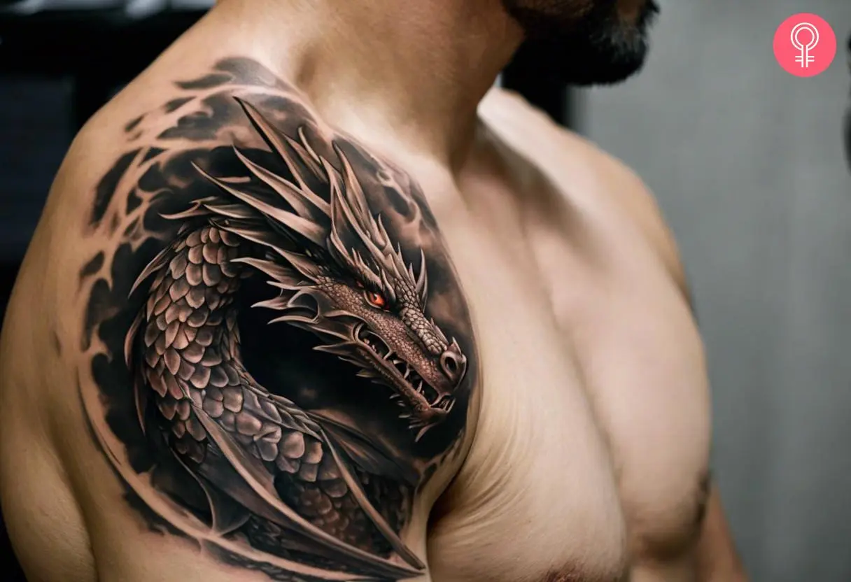 A man wearing a dragon shoulder tattoo on the shoulder