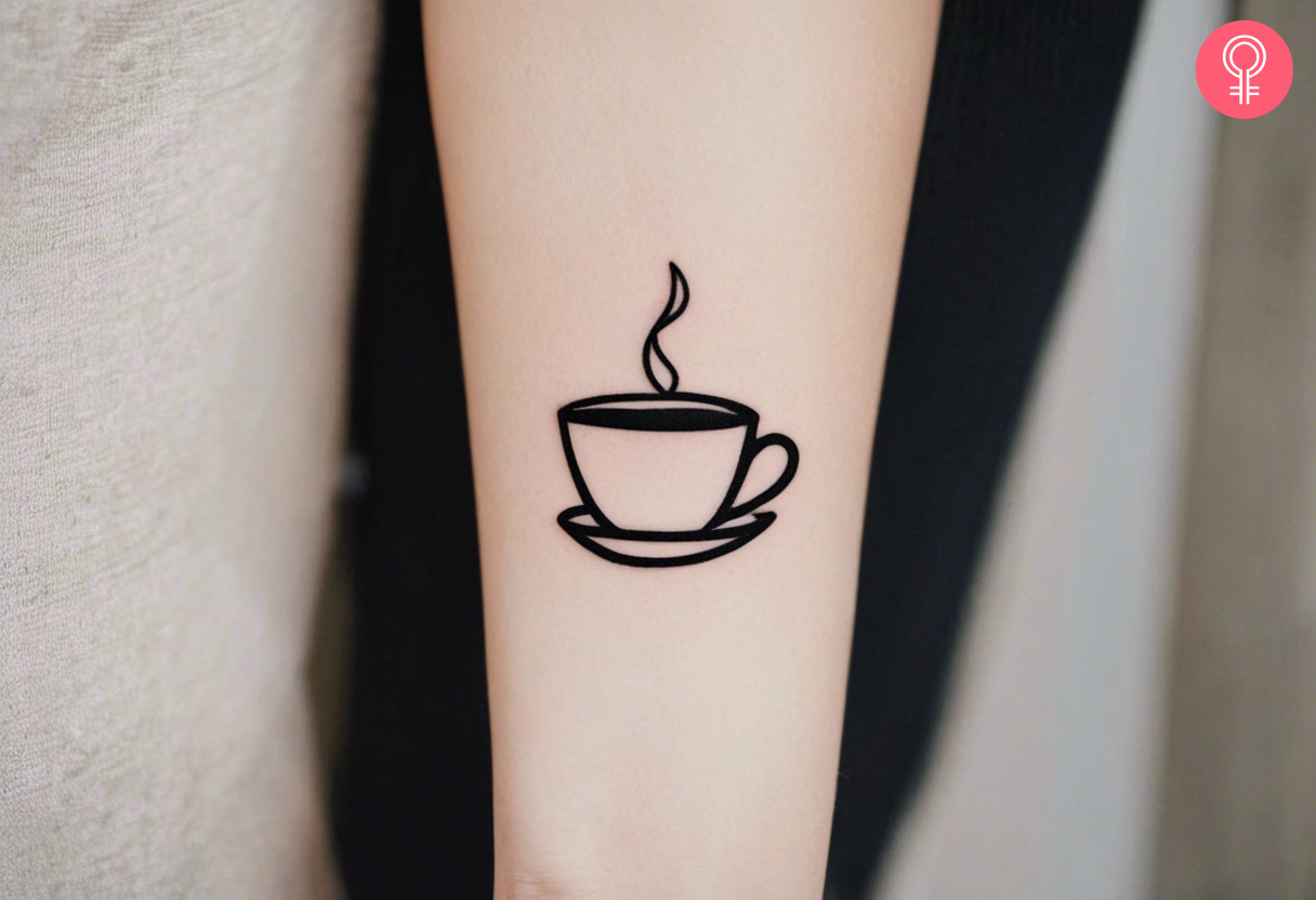 A minimalist coffee tattoo on the forearm